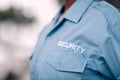 Uniform, security guard and in closeup for protection from crime with worker for safety in mock up background. Duty Royalty Free Stock Photo