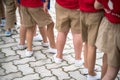 Uniformed children aligned legs