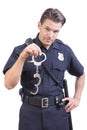Uniformed police officer holding handcuffs Royalty Free Stock Photo