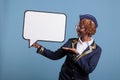 Uniformed stewardess holding dialogue window