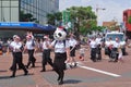 Members of St. John New Zealand marching at a Christmas parade