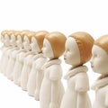 Uniformity, identity, monotony, many identical dolls stand in a row next to each other on a white