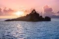 Uninhabited Seychelles island - view from the sea during sunset