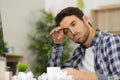 Uninspired man struggling to write letter Royalty Free Stock Photo