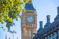 The Union Flag flying in front of the clock tower Big Ben, Palace of Westminster. London UK