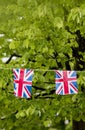 Union Jack bunting flapping in the breeze celebrating British event outside a shopping centre in England, United Kingdom