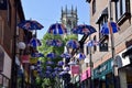 Union Jack Coronation Umbrellas over Coppergate Walk, with Church of All Saints behind.