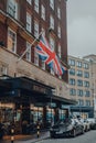 Union Jack about the entrance to Radisson Blue Edwardian Berkshire Hotel, London, UK