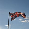 Union jack flag against a blue sky Royalty Free Stock Photo