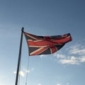 Union jack flag against a blue sky Royalty Free Stock Photo