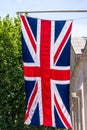 Union Jack Flag flying from a flag pole on The Mall street. London. England Royalty Free Stock Photo