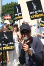 Union members walk the picket line in support of the SAG-AFTRA and WGA