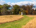 A Union monument and civil war cannons in the Wheatfield on the Gettysburg National Military Park Royalty Free Stock Photo