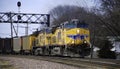 Union Pacific double header pulls a coal train under the signal bridge