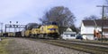 Union Pacific double header pulls a coal train under the signal bridge