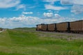 Union Pacific locomotive 8135 heads eastbound with a train with coal loaded hoppers with helper Union Pacific diesel locomotive Royalty Free Stock Photo