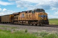 Union Pacific locomotive 8135 heads eastbound with a train with coal loaded hoppers with helper Union Pacific diesel locomotive