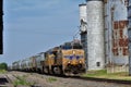 Union Pacific Train shot closeup on a railroad track with grain bins in Kansas that`s bright and colorful. Royalty Free Stock Photo