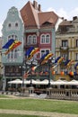 Union Square in Timisoara decorated festive with Romanian flags blown by wind