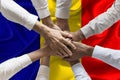 Union or Team Hands multcultural people team over romanian flag topview Royalty Free Stock Photo