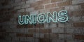 UNIONS - Glowing Neon Sign on stonework wall - 3D rendered royalty free stock illustration