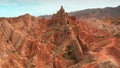 A unique aerial landscape of flying over the red stone valley. A flight along the wall of red rocks, similar to the Royalty Free Stock Photo