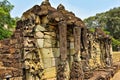 Unique Angkor. Terrace of elephants. On a stone pedestal, there are sculptures of elephant heads with long trunks.