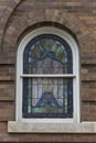 Unique arched stained glass window. Royalty Free Stock Photo