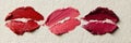 Creative Lipstick Smear Arrangement on Textured Paper Background Showcasing Different Shades and Artistic Expression in Royalty Free Stock Photo