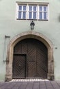 Unique beautiful home entrance with lamp and round wooden brown door