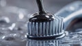 Unique Charcoal Toothpaste Dripping Onto a Toothbrush on a Dark Surface Royalty Free Stock Photo