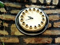 Unique clock on the wall made in the form of a cake.