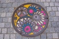 Unique and colorful manhole cover in the street of Matsumoto city