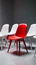 Unique concept red chair stands out among white counterparts