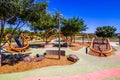 Unique Curved Orange Playground Equipment In Public Park Royalty Free Stock Photo