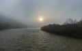 A unique dawn in the Carpathians with fog over a fast river.