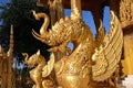 A unique design golden typical Thai style lion statue stands out from the blue sky in central region of Thailand Royalty Free Stock Photo