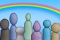 Unique and diverse looking characters standing beneath a rainbow, symbolizing the concept of diversity and inclusion.
