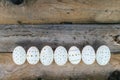 Unique Easter eggs on wooden background
