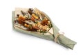 Unique edible bouquet consisting of dried fish, crackers, dried squid isolated on white background