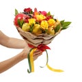 Unique festive bouquet consisting of apples, pears, mountain ash, lemons, viburnum, pomegranates and blooming roses in the hands o