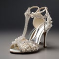 a unique footwear with pearls and white soft material base of satin