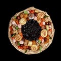 Unique gift bouquet consisting of dried fruit, top view on a black background