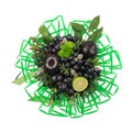 Unique gift handmade in the form of bouquet of flowers and fruits decorated with many green straws for drinks on a white backgroun