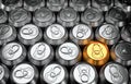 Unique golden can among group of silver recyclable cans cans. View from above Royalty Free Stock Photo