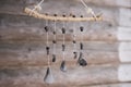 Unique handmade wind chime made of branch and black ceramic bells