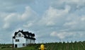 Unique house in a farm with blue sky background