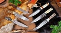 Unique Hunting Knives on wooden Background Royalty Free Stock Photo