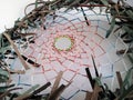 Unique Indian dreamcatcher made with sinew and leather on a white background