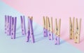 Unique, individuality, leadership and think different concept. One wooden clip difference with other clips, vintage pastel colored Royalty Free Stock Photo